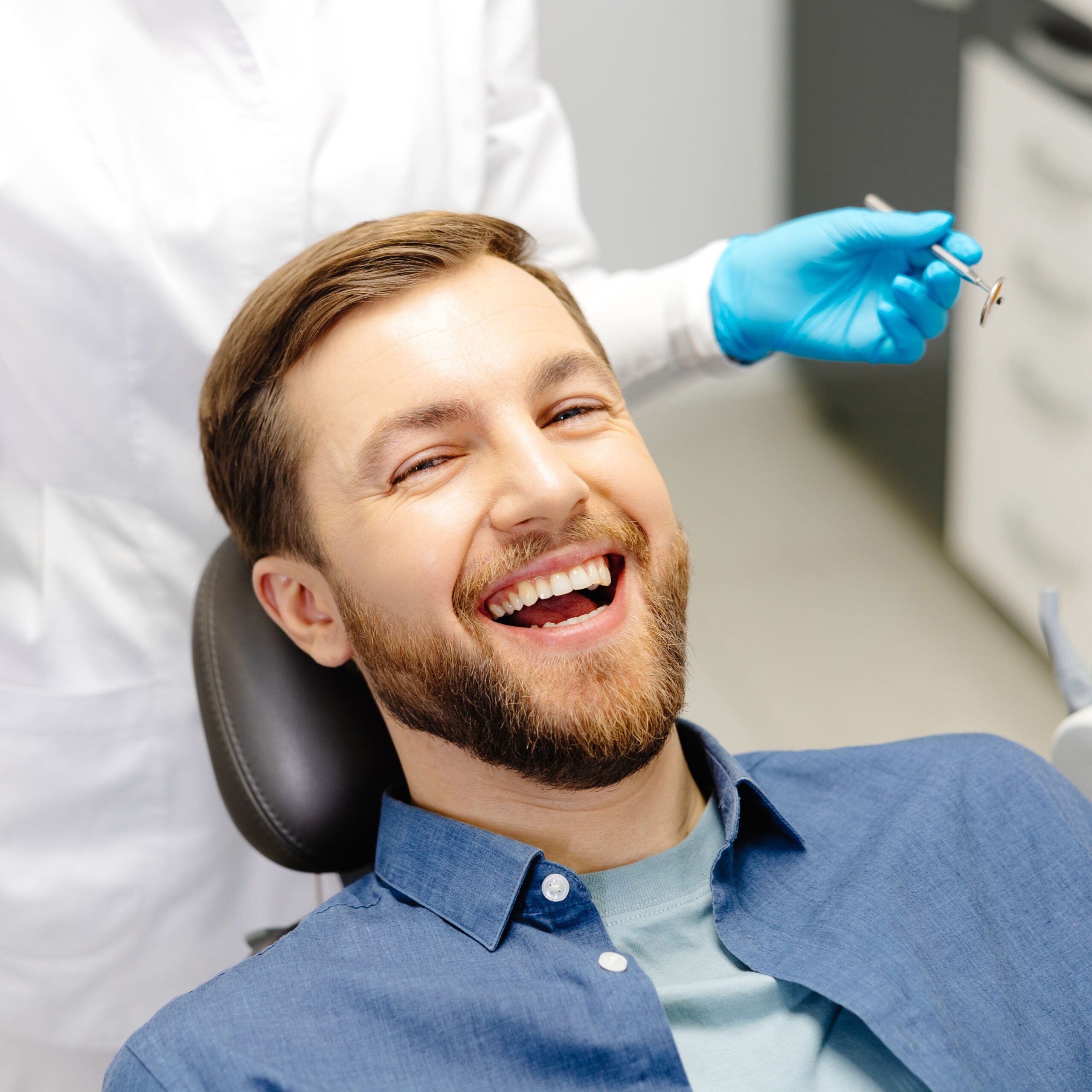 Happy patient smiling confidently after dental implant treatment at Natural Clinic, Istanbul.