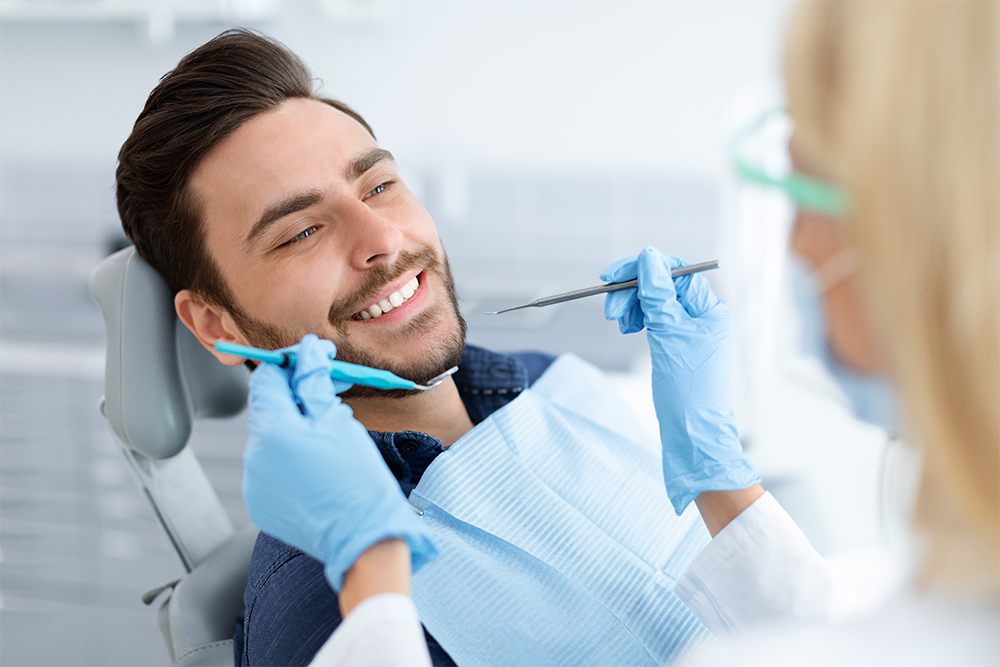 Smiling male patient during dental consultation