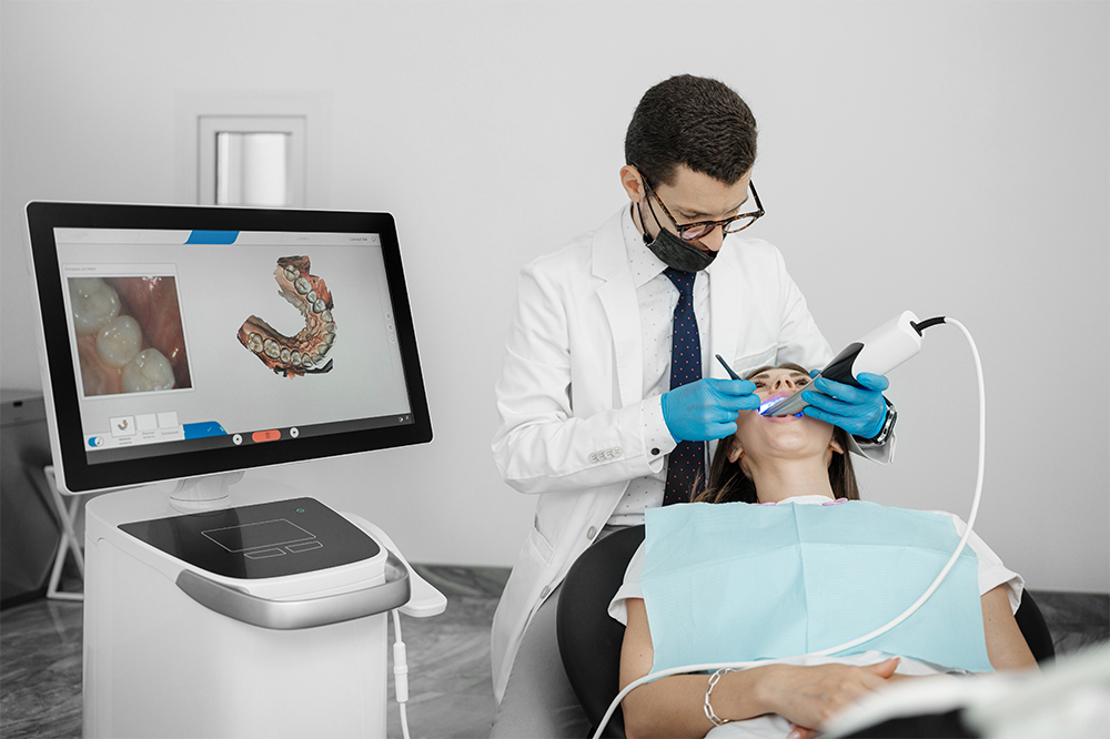 Advanced dental technology intraoral scanner with real-time 3D dental impressions by a male dentist