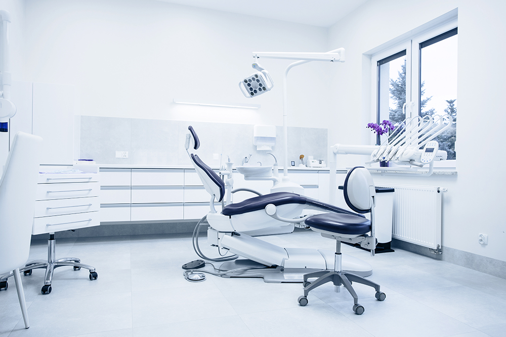 High-tech dental treatment room with ergonomic chair and sterile equipment in a modern clinic